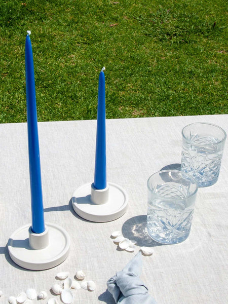 Blue Moreton Taper Candle 25cm - Capri on table outdoors, unscented, eco-friendly, long-lasting burn.